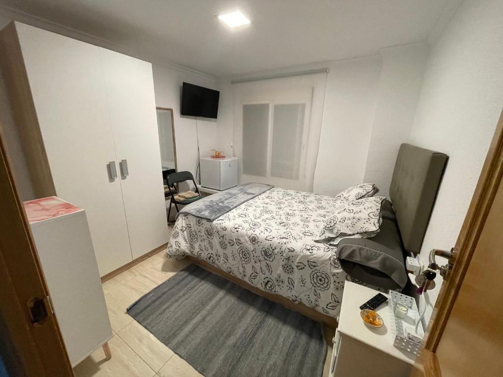 A bed or beds in a room at El Patio de Lucy