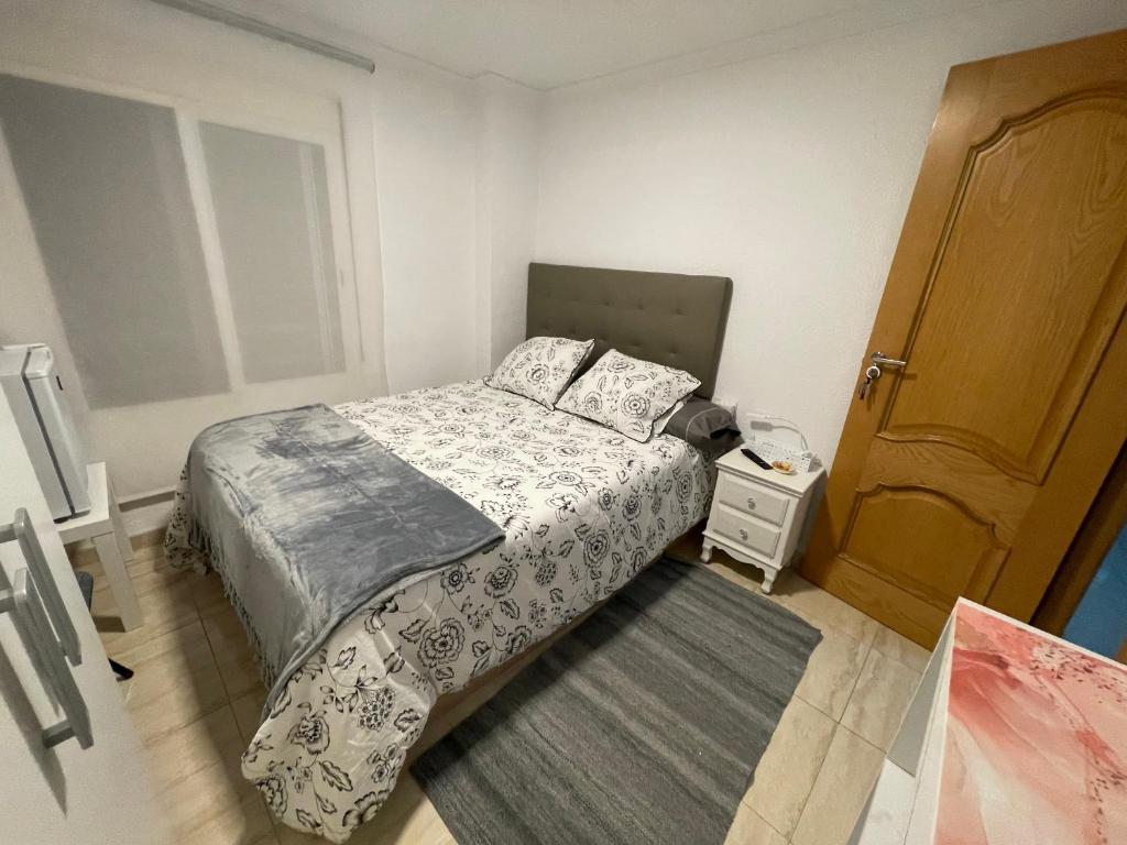 A bed or beds in a room at El Patio de Lucy