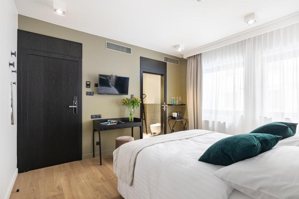 Posteľ alebo postele v izbe v ubytovaní Apartamenty Deo Plaza - Old Town by Rent like home
