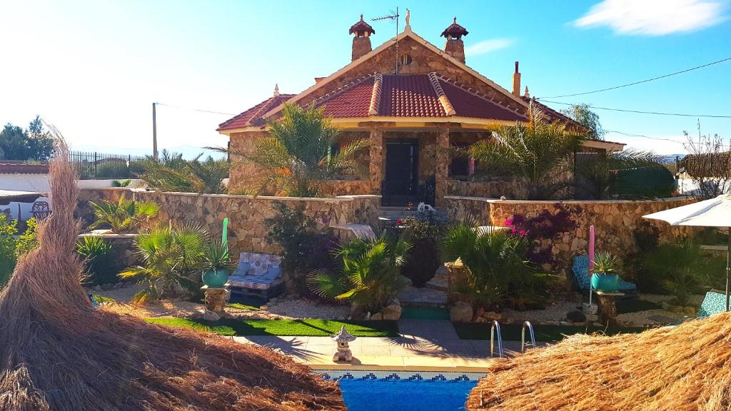 a house with a pool in front of it at Charming Villa La Mar in Albox