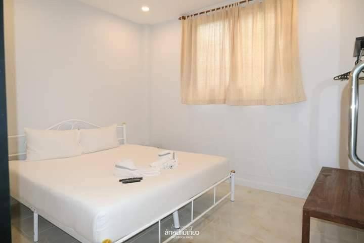Postel nebo postele na pokoji v ubytování March Samui Resort