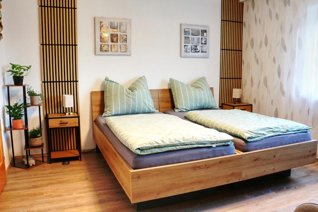 two beds with pillows on them in a room at Apartment Andreas Bichler in Weistrach