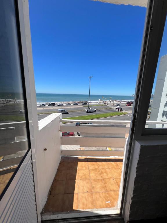 an open door to a view of an airport runway at La PerlaApart in Mar del Plata