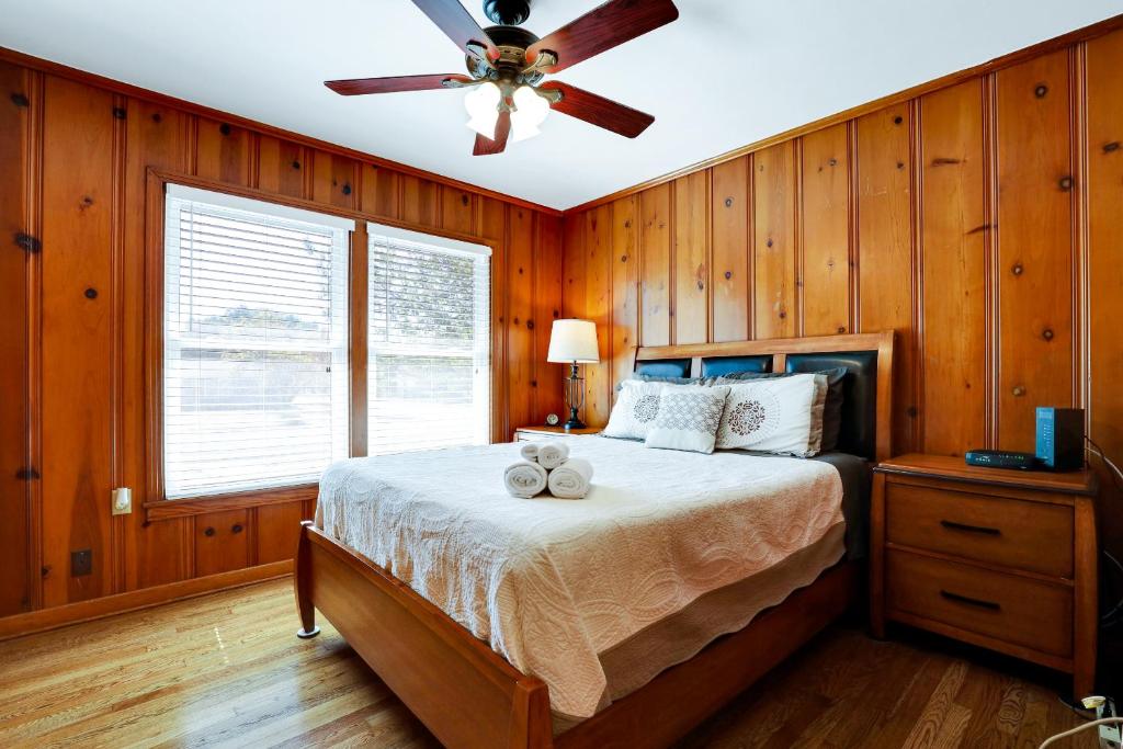a bedroom with a bed with a ceiling fan at Fortuitous - A Birdy Vacation Rental in San Antonio