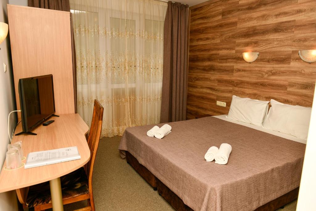 Postel nebo postele na pokoji v ubytování Blyan Family Hotel