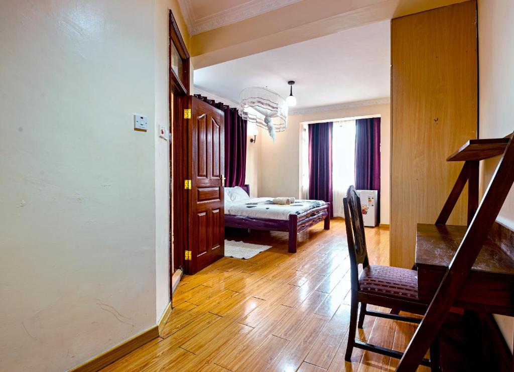 Letto o letti in una camera di MANI HOMES