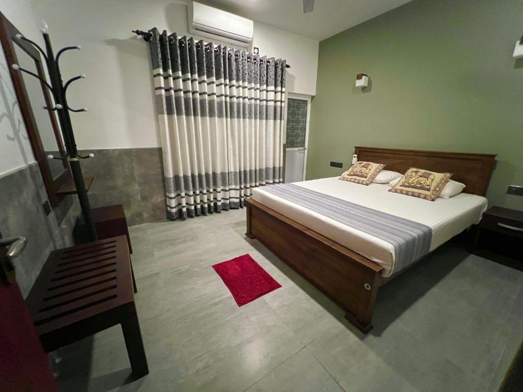 Postel nebo postele na pokoji v ubytování DELMOND Lake - Anuradhapura