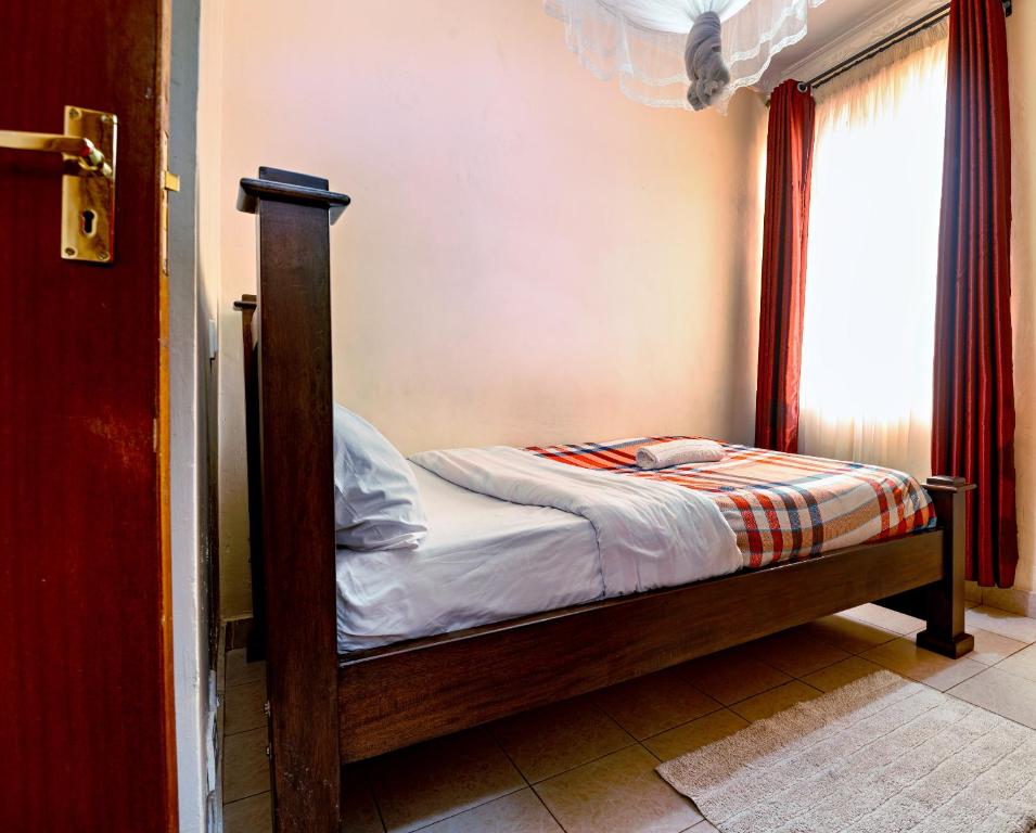 Letto o letti in una camera di MANI HOMES