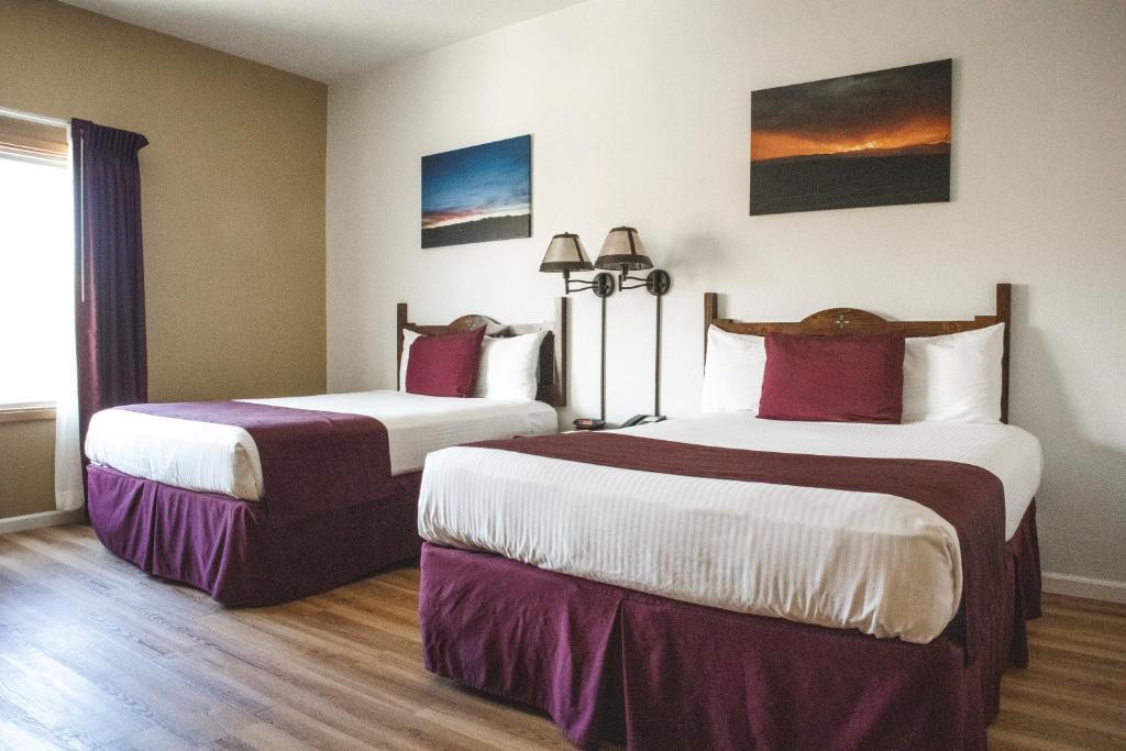 a hotel room with two beds in a room at Ohkay Hotel Casino in San Juan Pueblo