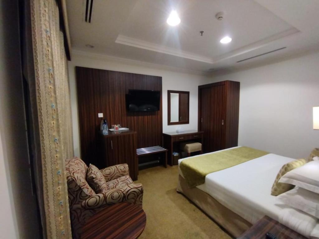 Postel nebo postele na pokoji v ubytování فندق اوتاد المتحدة الماسي awtad elmasi hotel
