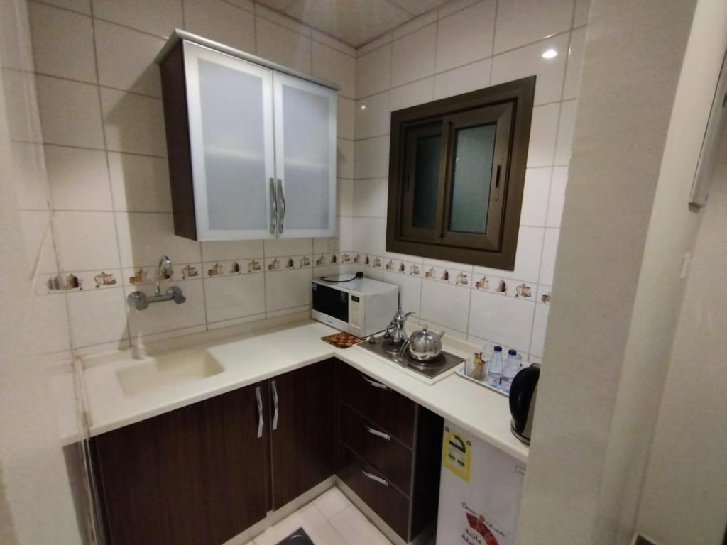 Kuchyň nebo kuchyňský kout v ubytování فندق اوتاد المتحدة الماسي awtad elmasi hotel