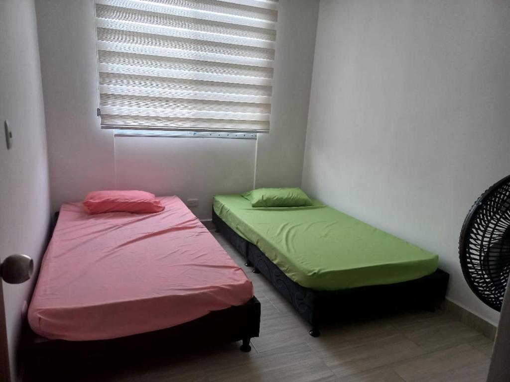 Postel nebo postele na pokoji v ubytování Apartamento en Ricaurte, Arrayanes de Peñaliza