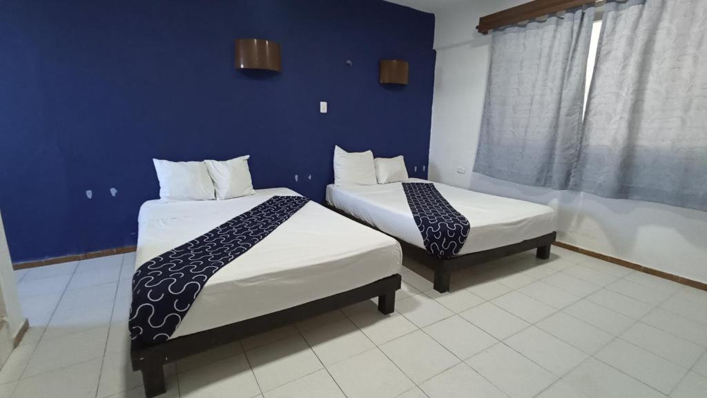 Postel nebo postele na pokoji v ubytování Hotel Tropical