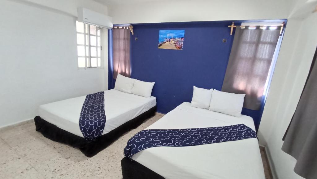 Postel nebo postele na pokoji v ubytování Hotel Tropical