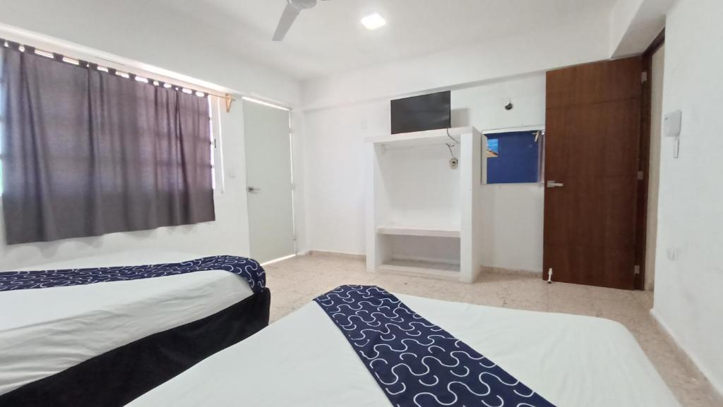 Postel nebo postele na pokoji v ubytování Hotel Tropical