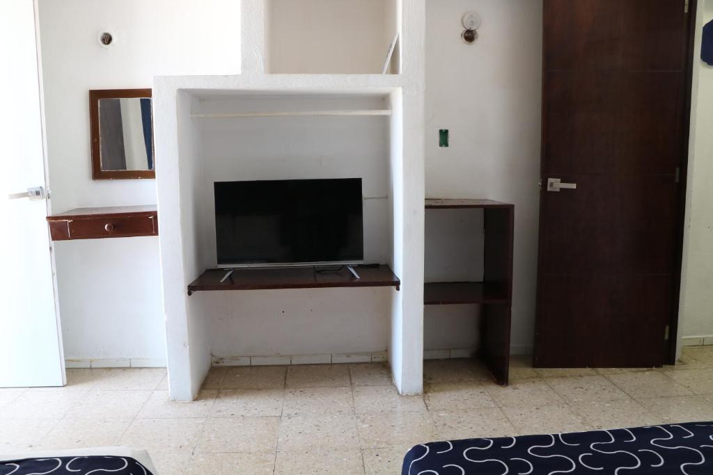TV a/nebo společenská místnost v ubytování Hotel Tropical