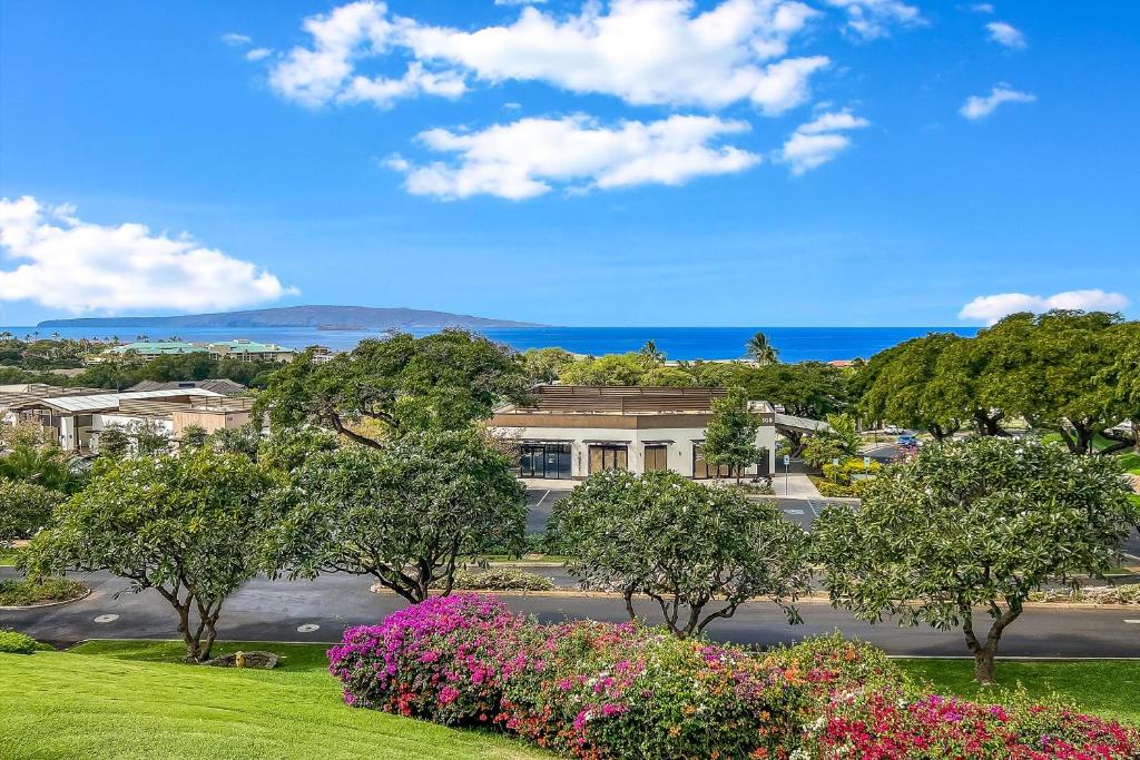 a view of a street with trees and flowers at Wailea Ekolu 102 - Molokini Views, Split AC in Wailea