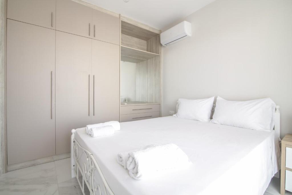 Ένα ή περισσότερα κρεβάτια σε δωμάτιο στο G Quattro Luxury Apartments