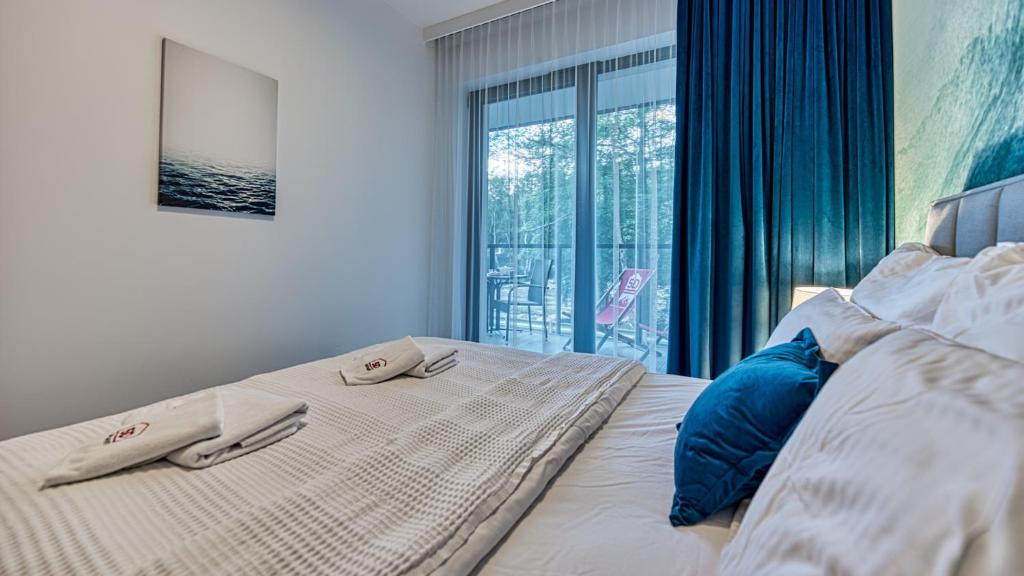 Posteľ alebo postele v izbe v ubytovaní Rezydencja Niechorze 224 - 5D Apartamenty