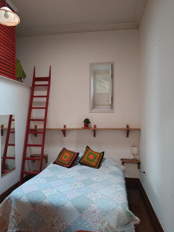 Postel nebo postele na pokoji v ubytování Hostal Tulio Porteño