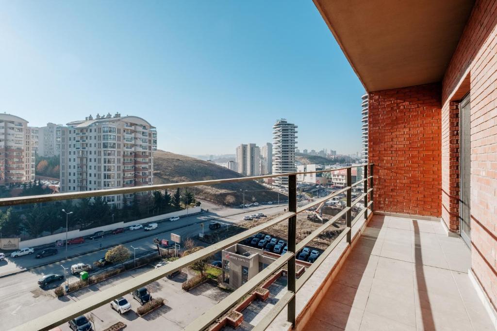 a balcony with a view of a city at Flat with Terrace Close to Transit in Ankara in Ankara