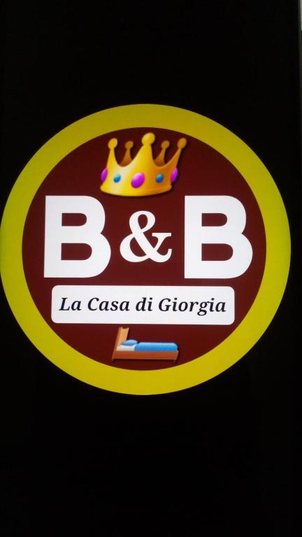 a b logo with a crown on it at La Casa Di Giorgia in Pozzuoli