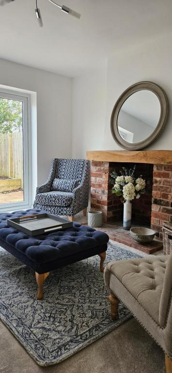 a living room with a couch and a mirror at Place to stay Market Rasen in Market Rasen