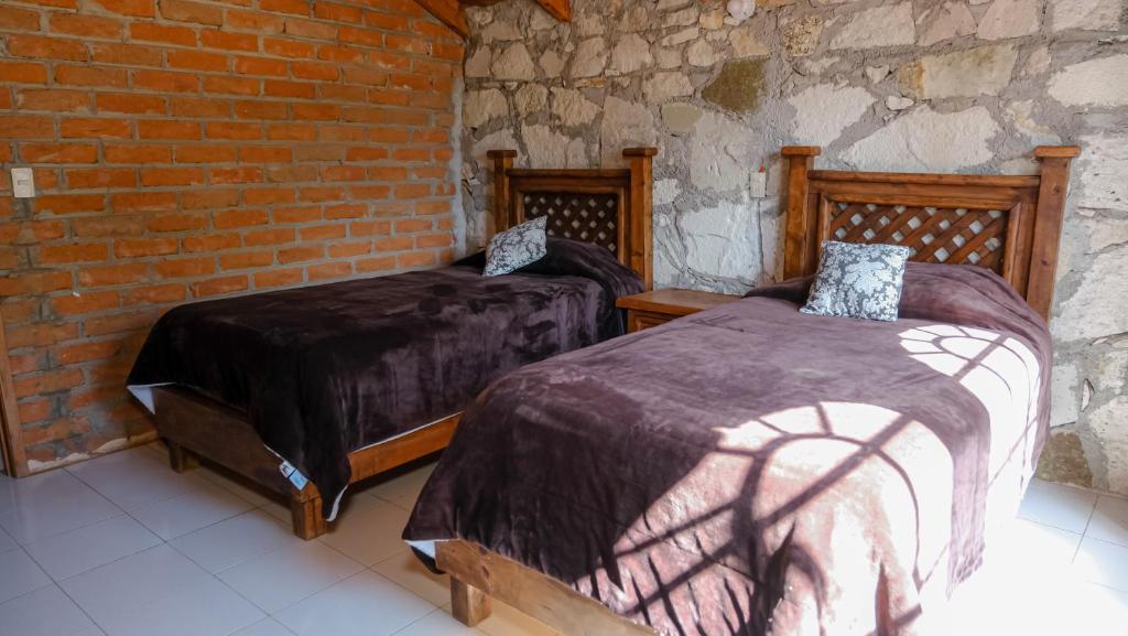 Postel nebo postele na pokoji v ubytování Hotel Real de San Antonio