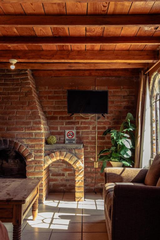 TV a/nebo společenská místnost v ubytování Hotel Real de San Antonio