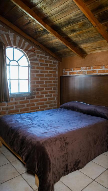 Postel nebo postele na pokoji v ubytování Hotel Real de San Antonio