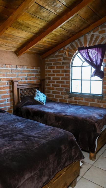 Postel nebo postele na pokoji v ubytování Hotel Real de San Antonio