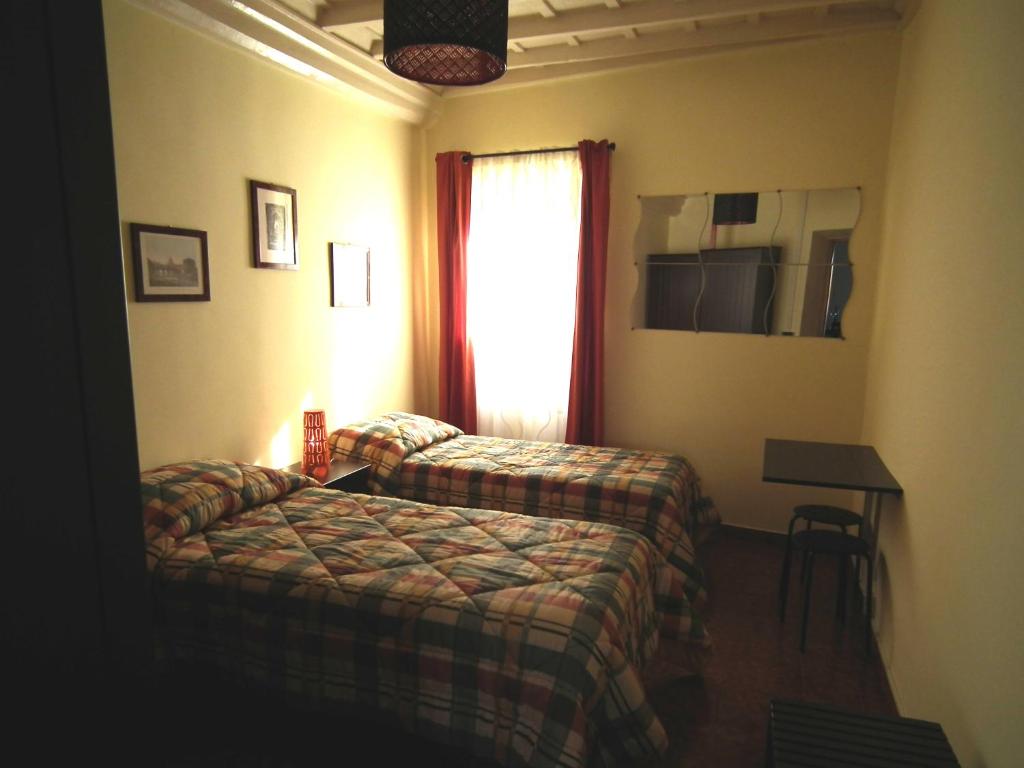 Postel nebo postele na pokoji v ubytování L'Attichetto di Zagarolo