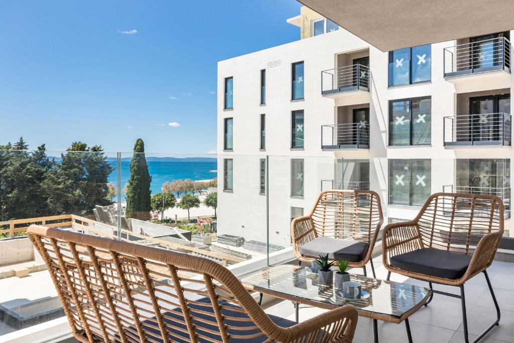 a patio with a table and chairs on a balcony at Apartment Karla in Split