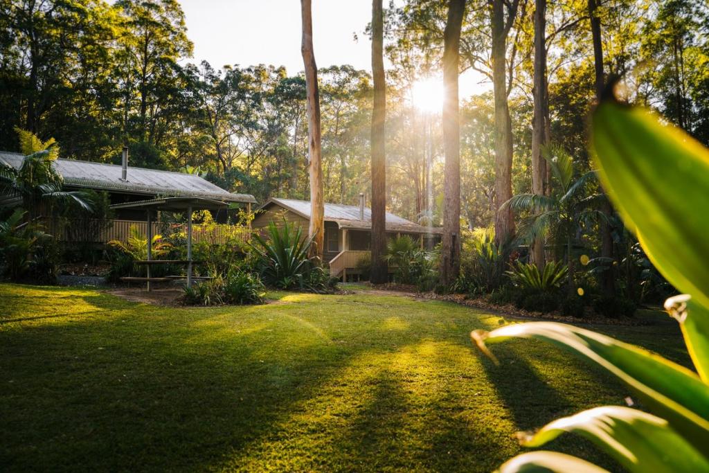 a house in the middle of a yard at Chiltern Lodge Country Retreat in Old Bar