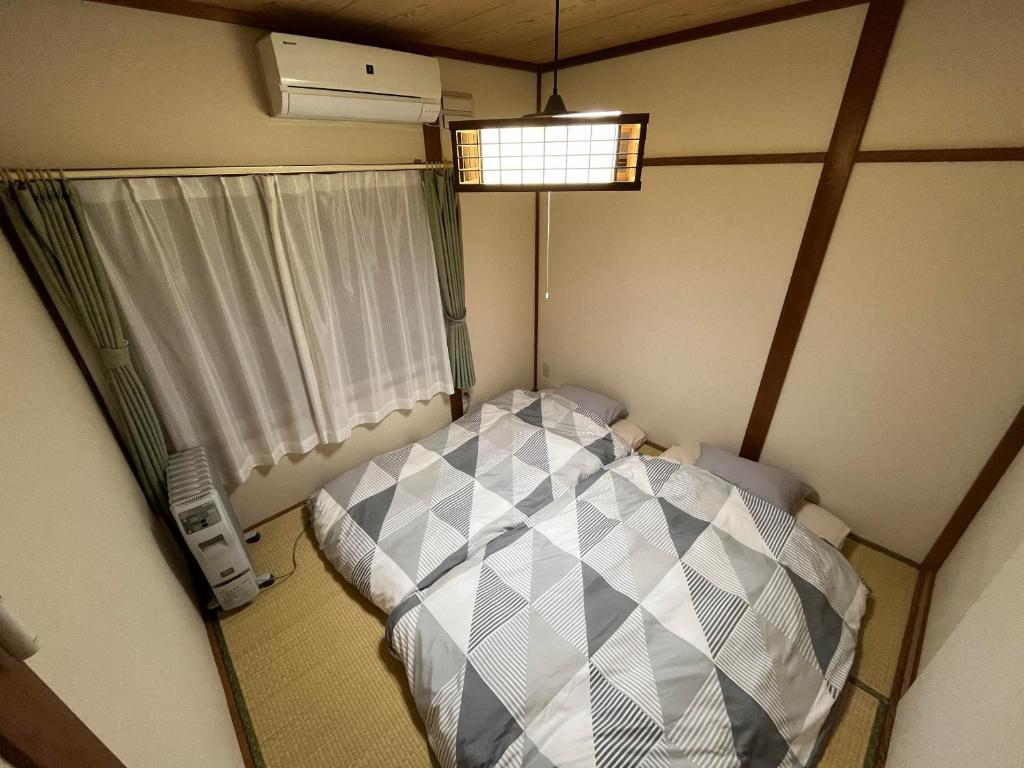 Voodi või voodid majutusasutuse Nagayama Home toas