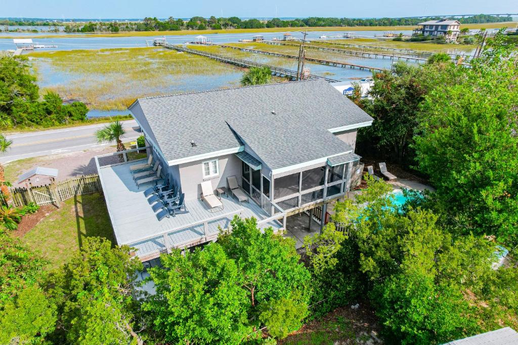an aerial view of a house with a river at 600 Palm Boulevard in Isle of Palms