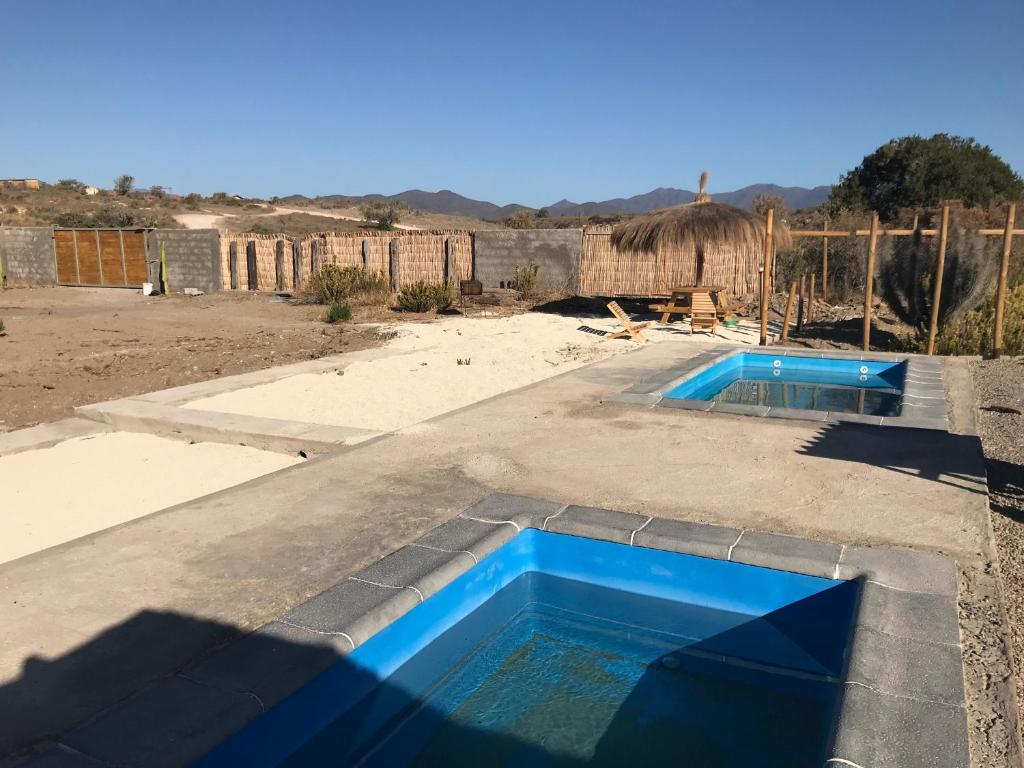 a swimming pool on the roof of a house at Eco Lodge Lorotuerto de Guanaqueros in Coquimbo