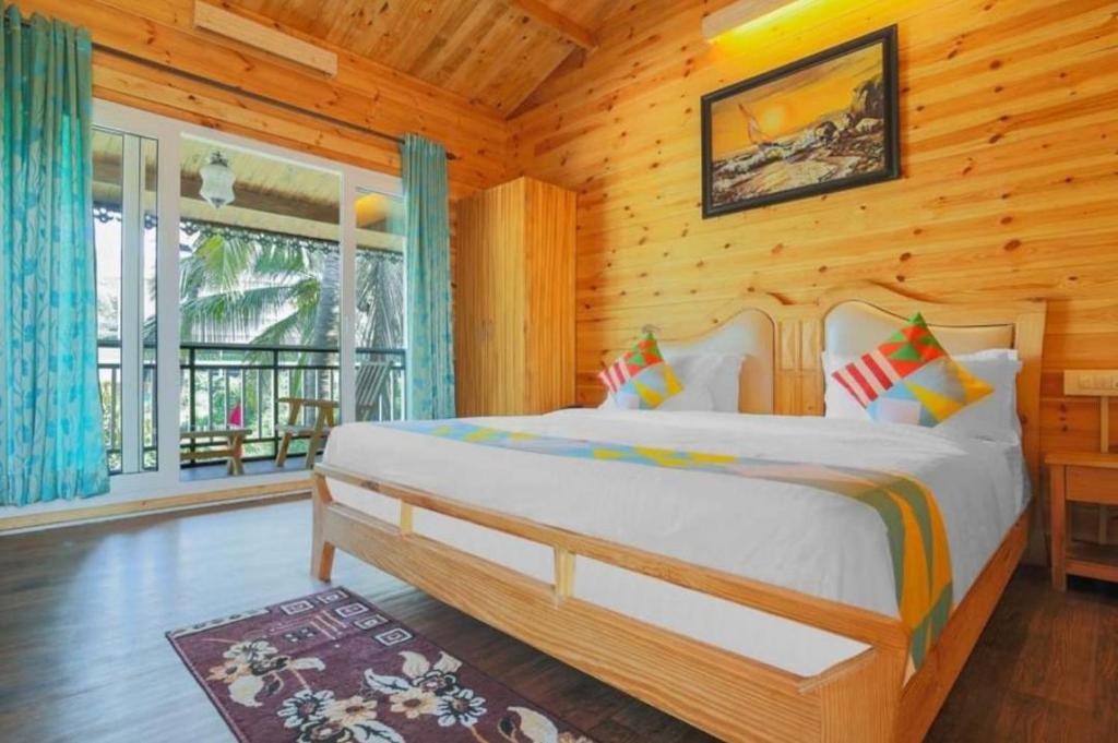 Postel nebo postele na pokoji v ubytování Obrigado Cottages