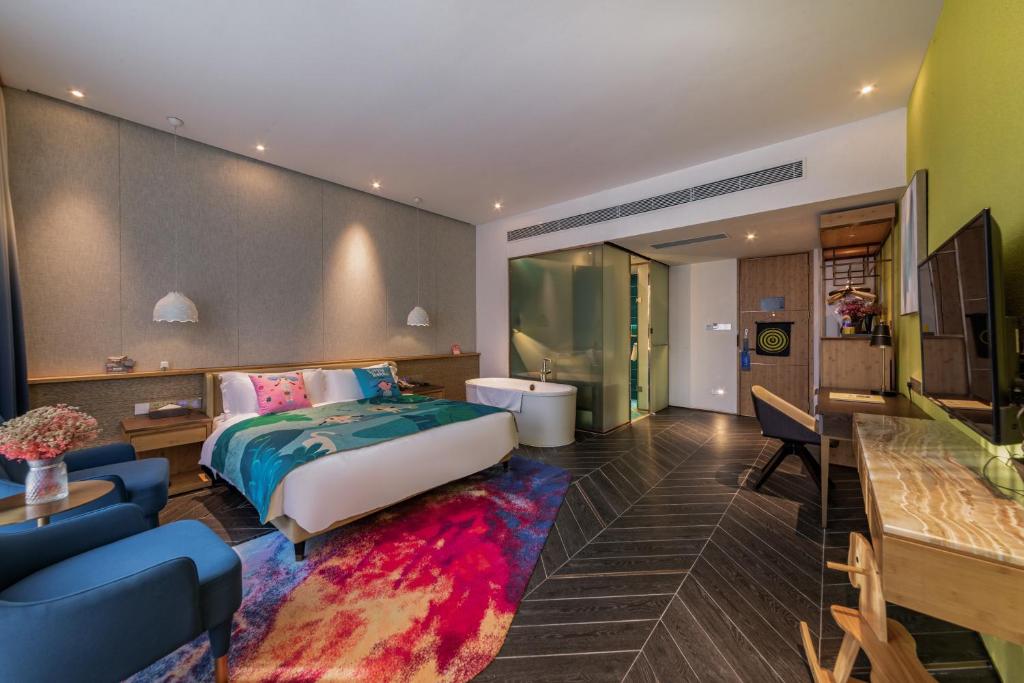 TV a/nebo společenská místnost v ubytování Nanxianglou Art Hotel