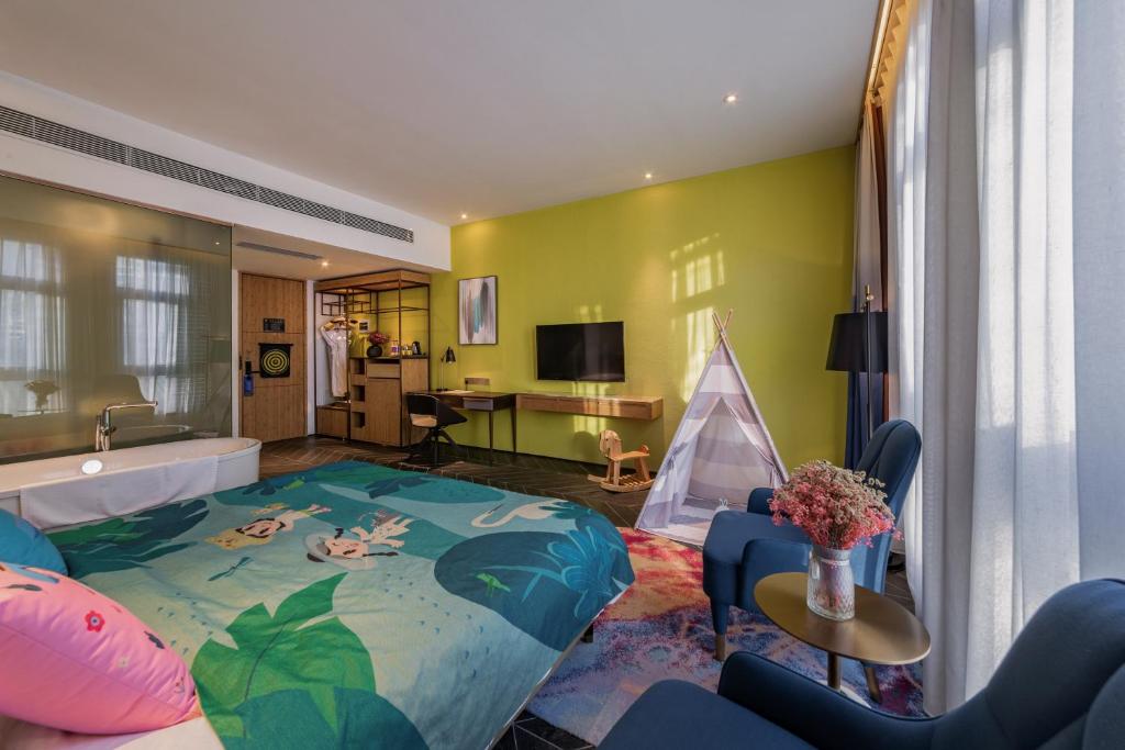 TV a/nebo společenská místnost v ubytování Nanxianglou Art Hotel