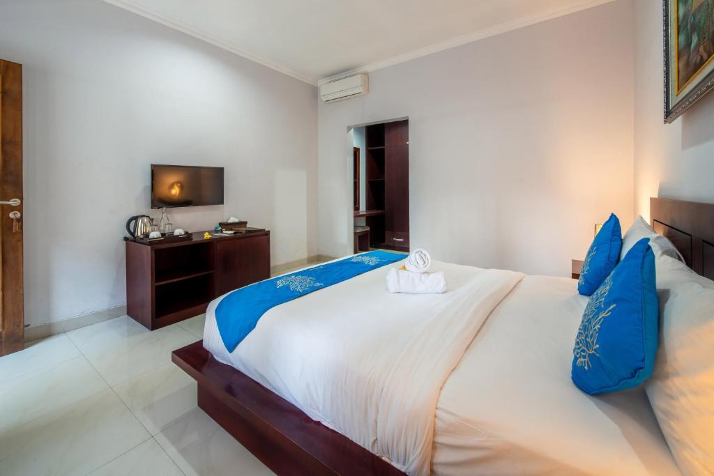 Tempat tidur dalam kamar di The Kutaya