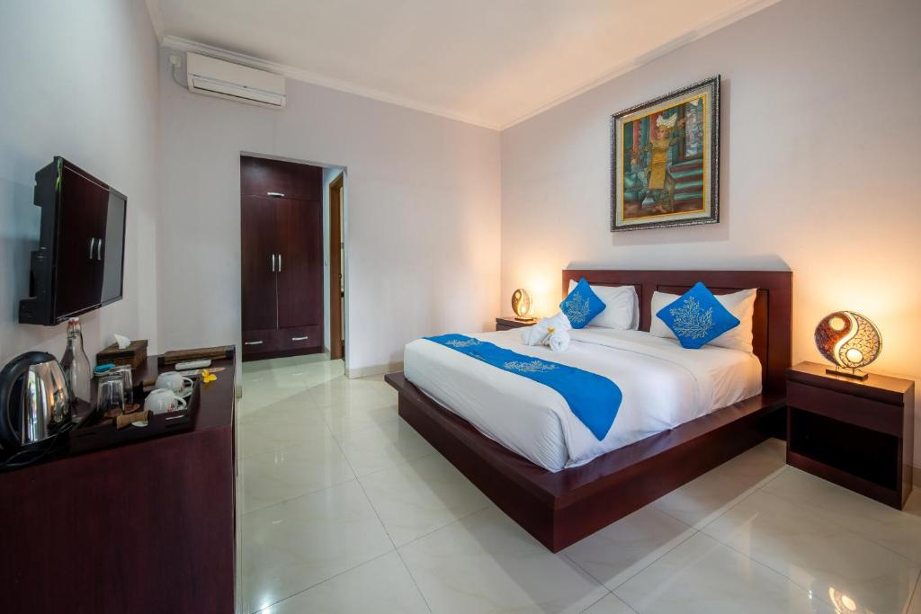 Tempat tidur dalam kamar di The Kutaya