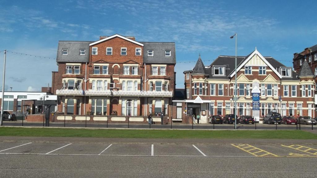 a row of buildings on the side of a street at Palm Court Hotel in Great Yarmouth