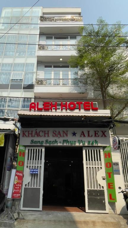 a hotel with a sign on the front of a building at ALEX HOTEL in Ho Chi Minh City