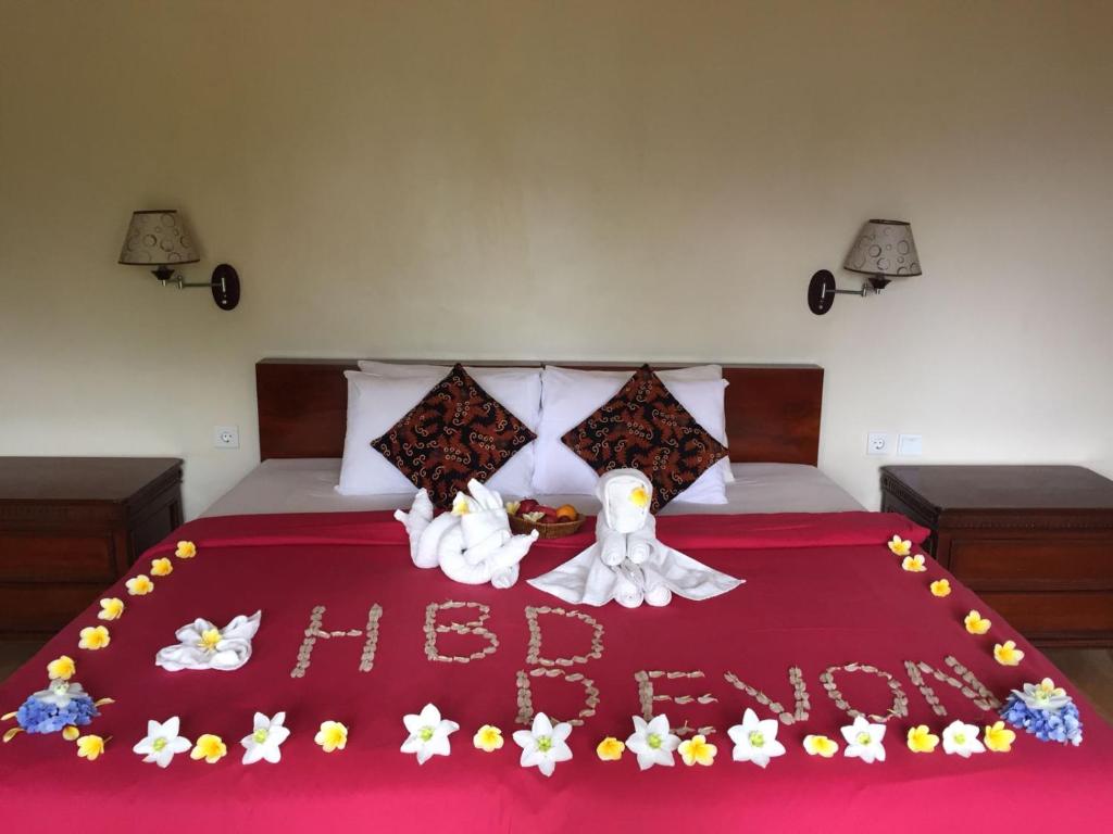 Voodi või voodid majutusasutuse Bali Rahayu Homestay toas