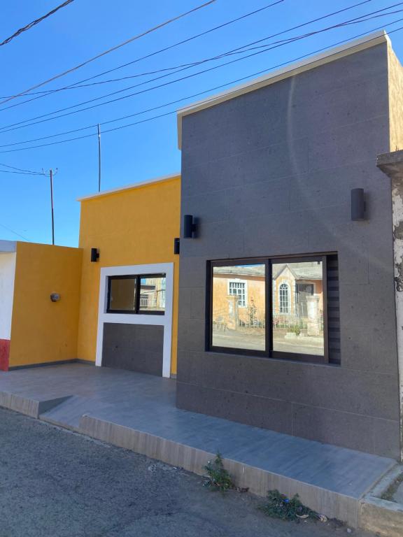 a rendering of a house with a large window at Casa de la esquina in Santa María del Oro