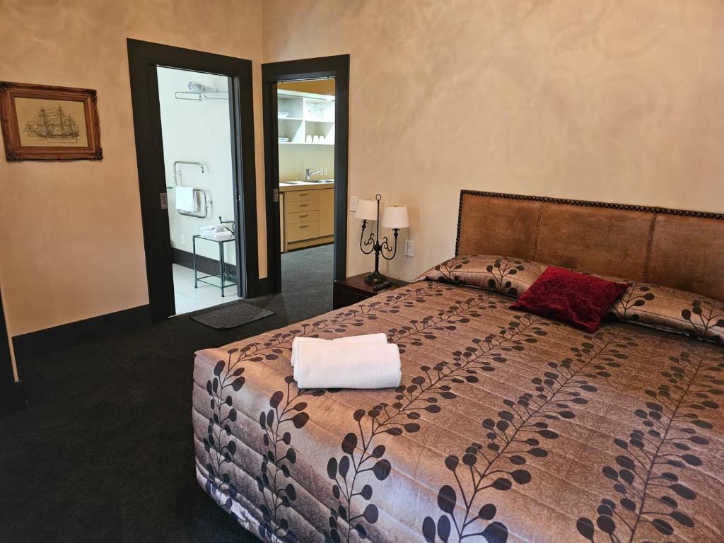 Postel nebo postele na pokoji v ubytování Gateway Motor Inn