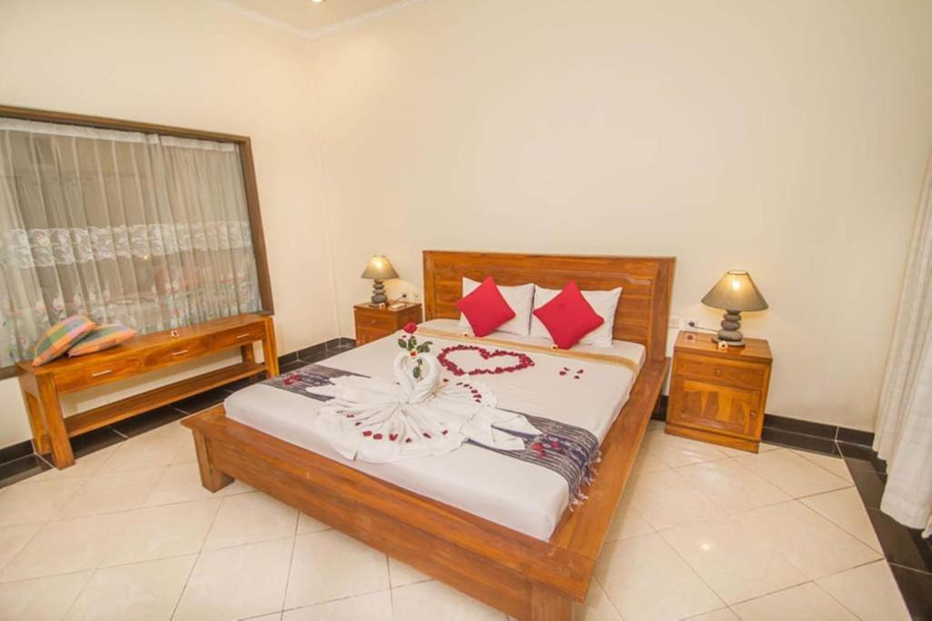 Postel nebo postele na pokoji v ubytování Adi Jaya Cottages Ubud Suites by EPS - CHSE Certified
