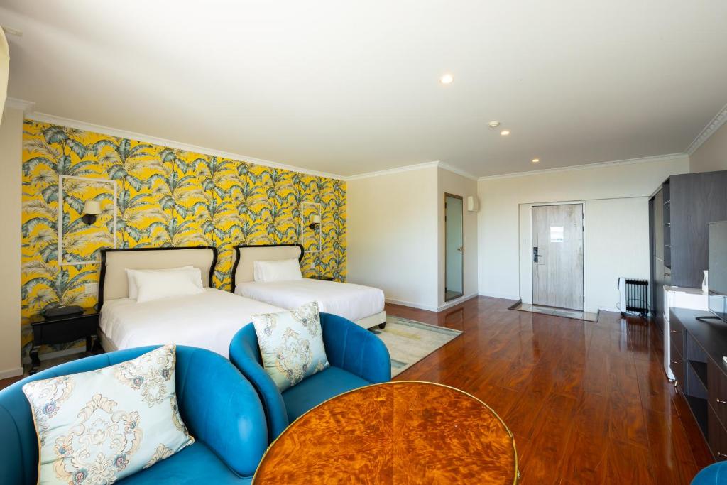 Postel nebo postele na pokoji v ubytování HOTEL HIMALAYA SEA