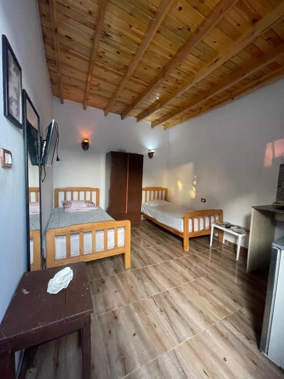 Postel nebo postele na pokoji v ubytování Nona’s House